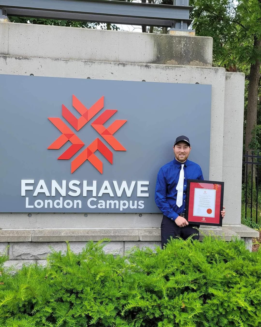 Interior view of a workshop/garage showing welding equipment (gas cylinder, welder machine) and tools. Represents the workspace.